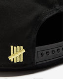 UNDEFEATED SCRIPT LOGO SNAPBACK
