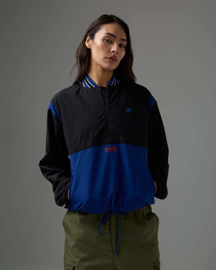 UNDEFEATED HALF ZIP WINDBREAKER
