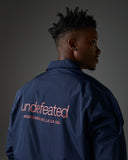 UNDEFEATED INC. COACHES JACKET