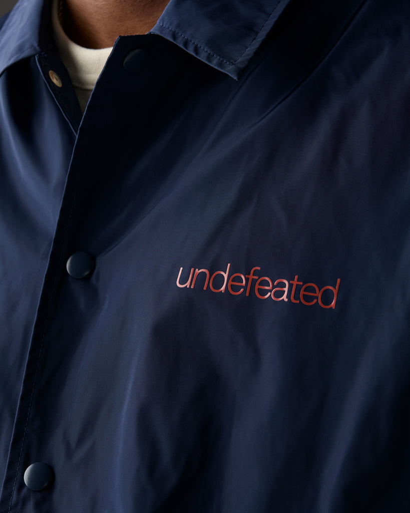 UNDEFEATED INC. COACHES JACKET