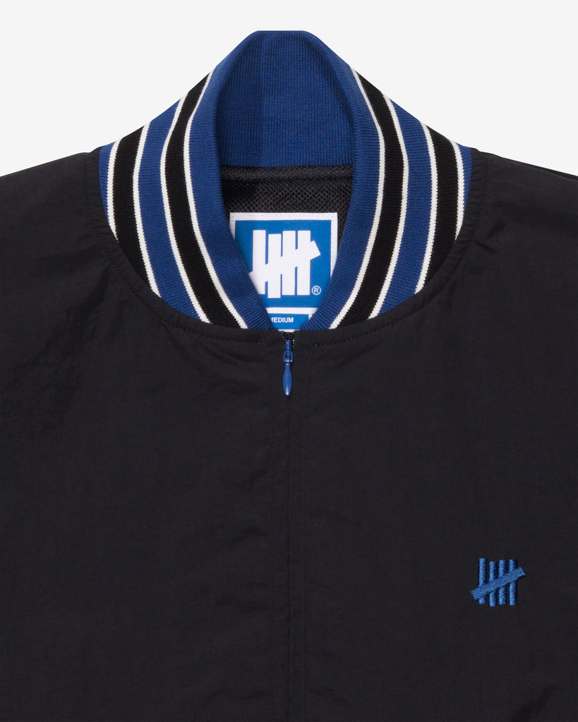 UNDEFEATED HALF ZIP WINDBREAKER