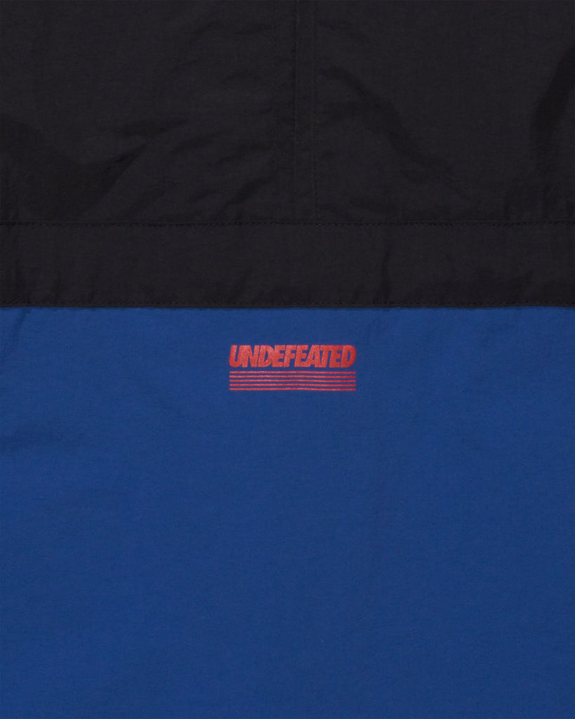 UNDEFEATED HALF ZIP WINDBREAKER