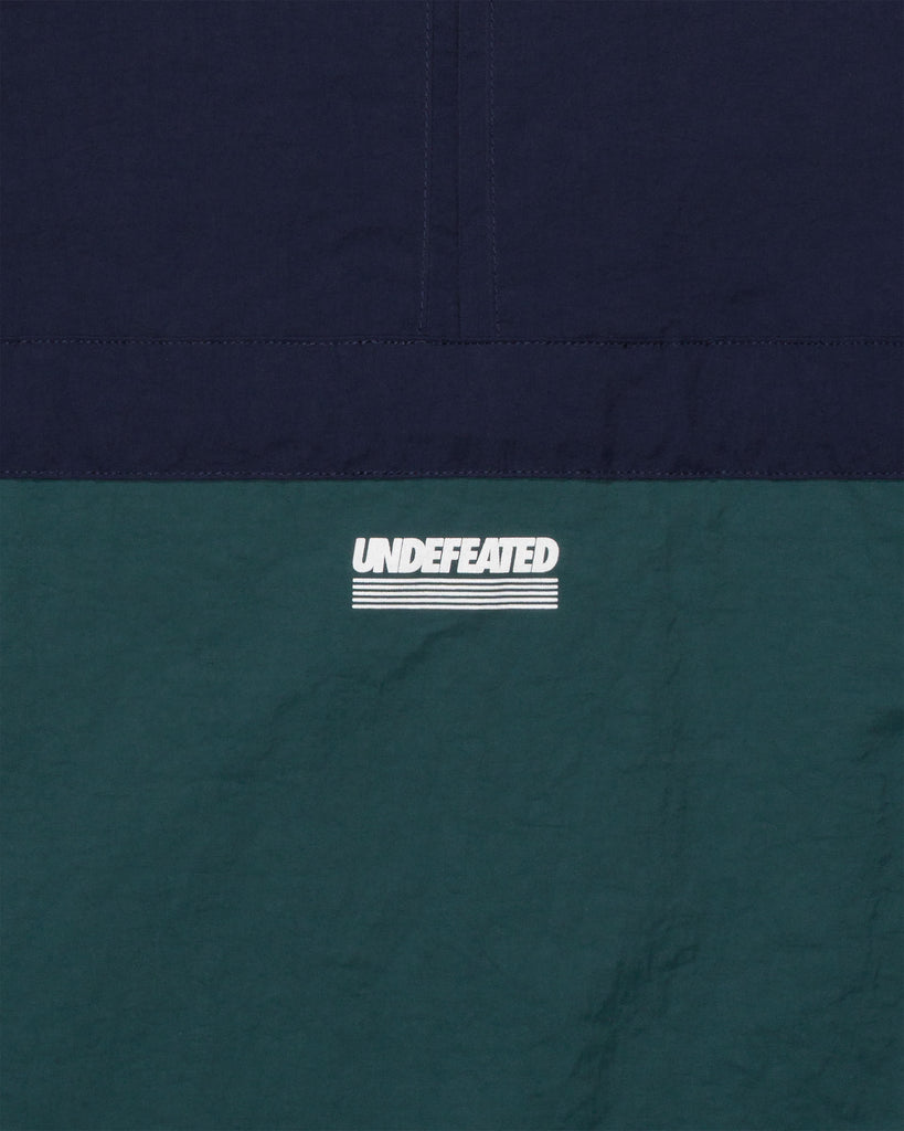 UNDEFEATED HALF ZIP WINDBREAKER