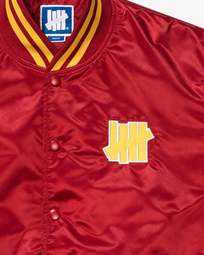 UNDEFEATED ICON SATIN VARSITY JACKET